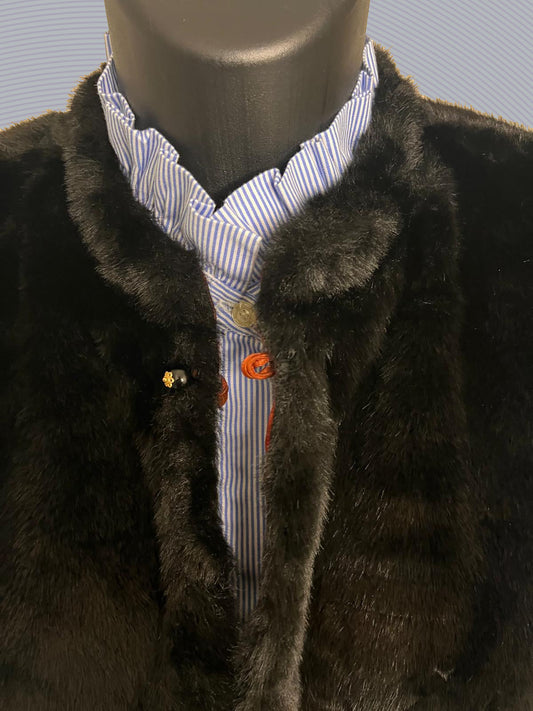 Cheltenham Festival Outfit Ideas: Why a Black Faux Fur Gilet is a race-day Essential.